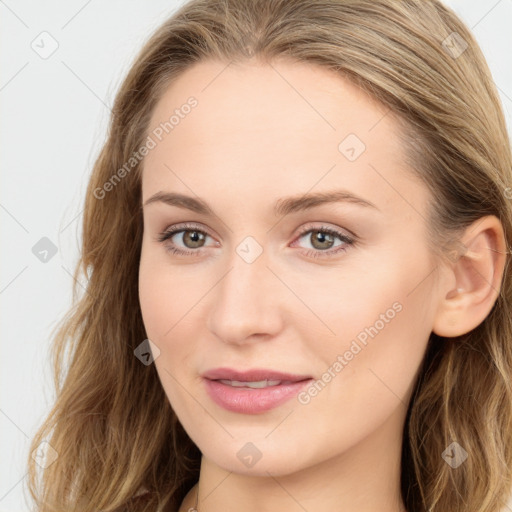 Joyful white young-adult female with long  brown hair and blue eyes