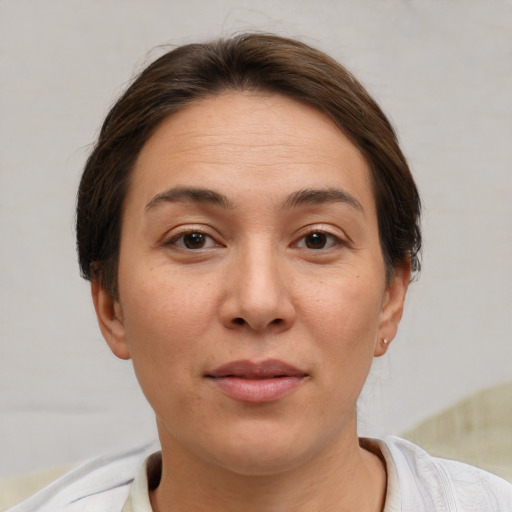 Joyful white adult female with short  brown hair and brown eyes