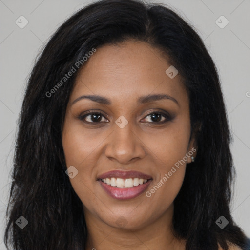 Joyful black young-adult female with long  brown hair and brown eyes