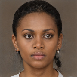 Neutral black young-adult female with long  brown hair and brown eyes