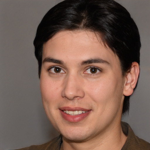 Joyful white young-adult male with medium  brown hair and brown eyes