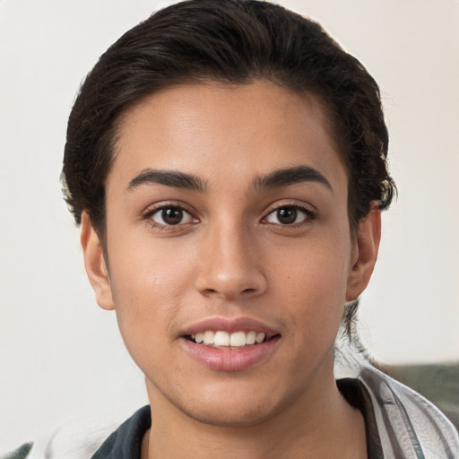 Joyful white young-adult female with short  brown hair and brown eyes