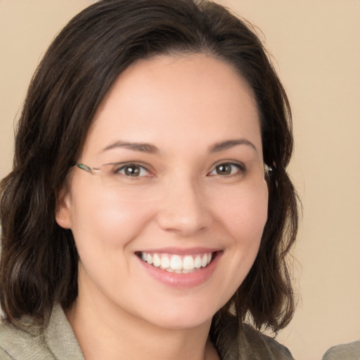 Joyful white young-adult female with medium  brown hair and brown eyes