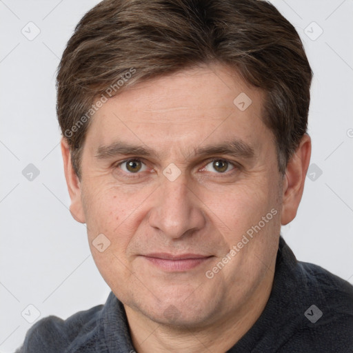 Joyful white adult male with short  brown hair and brown eyes