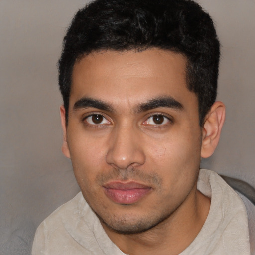 Neutral latino young-adult male with short  black hair and brown eyes