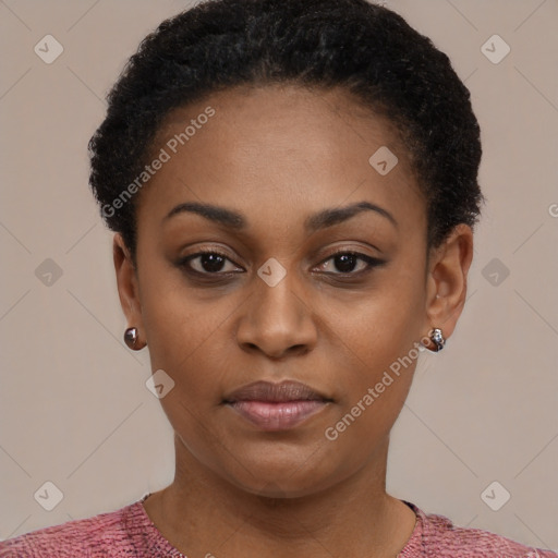 Joyful black young-adult female with short  black hair and brown eyes