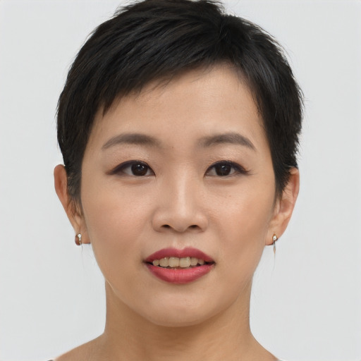 Joyful asian young-adult female with short  brown hair and brown eyes