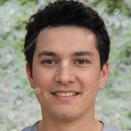 Joyful white young-adult male with short  black hair and brown eyes