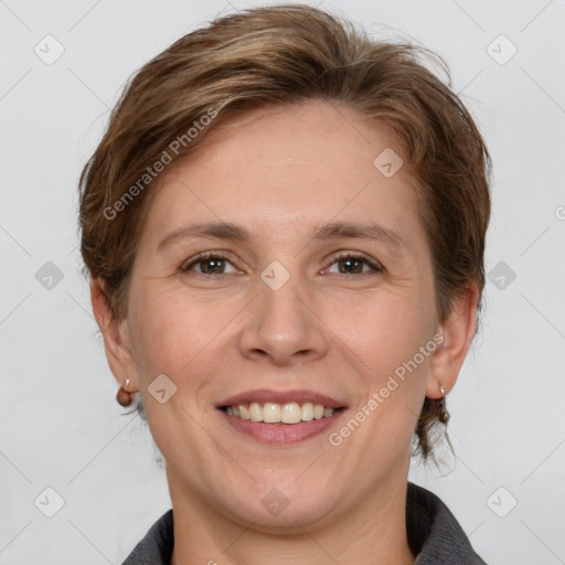 Joyful white adult female with medium  brown hair and grey eyes