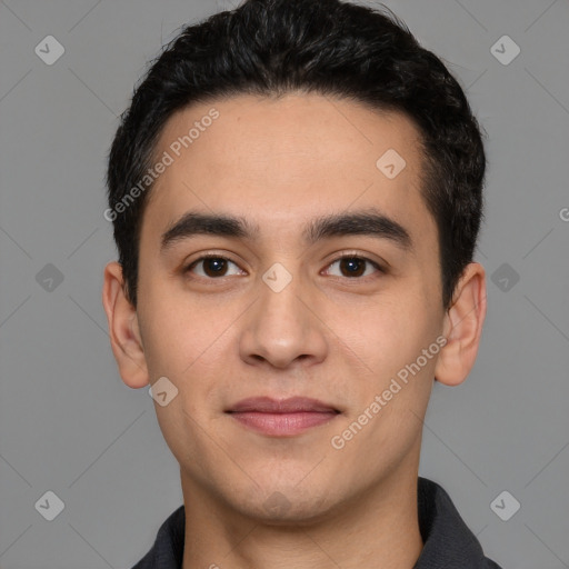 Joyful white young-adult male with short  black hair and brown eyes