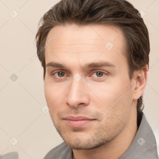 Neutral white young-adult male with short  brown hair and brown eyes