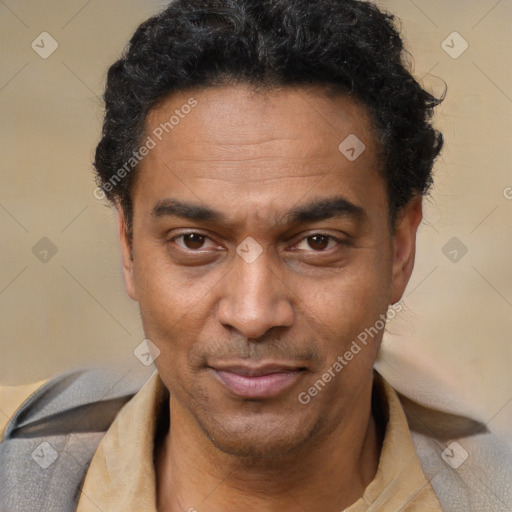 Joyful latino adult male with short  black hair and brown eyes