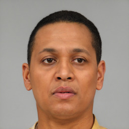 Neutral latino adult male with short  brown hair and brown eyes