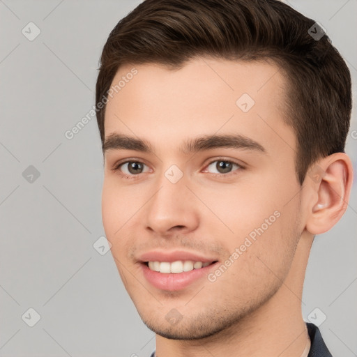 Joyful white young-adult male with short  brown hair and brown eyes