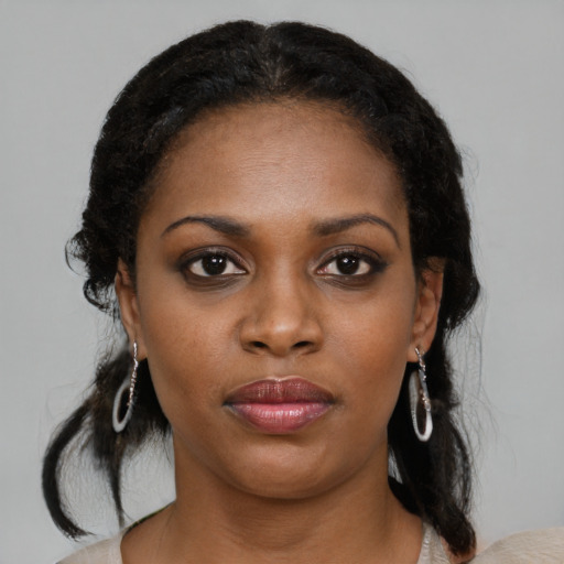 Neutral black young-adult female with medium  black hair and brown eyes