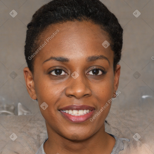 Joyful black young-adult female with short  brown hair and brown eyes