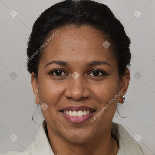 Joyful black adult female with short  brown hair and brown eyes