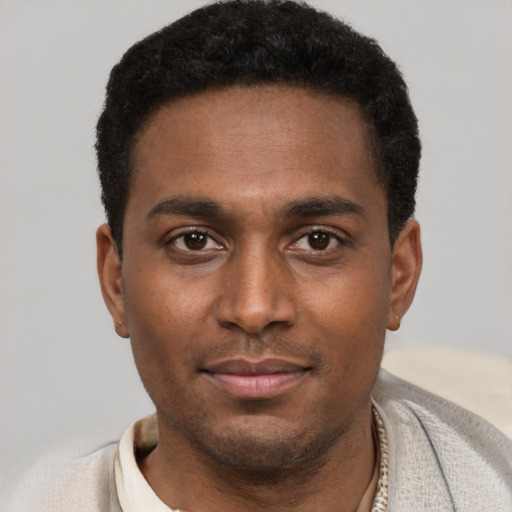 Neutral black young-adult male with short  black hair and brown eyes