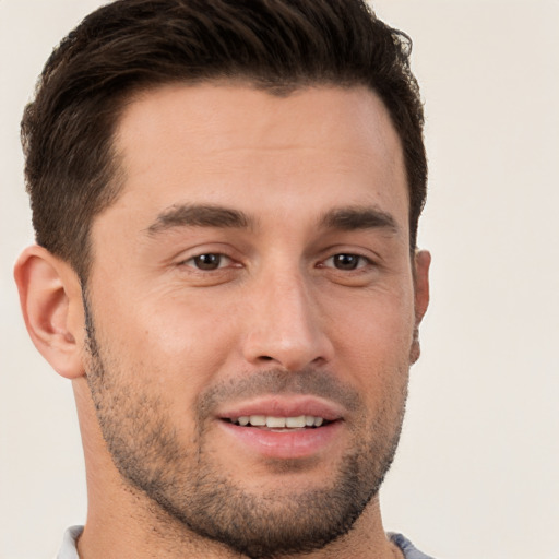 Joyful white young-adult male with short  brown hair and brown eyes