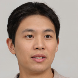 Neutral asian young-adult male with short  brown hair and brown eyes