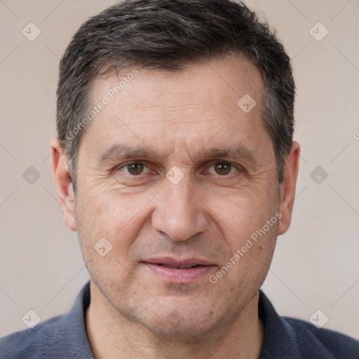 Joyful white adult male with short  brown hair and brown eyes