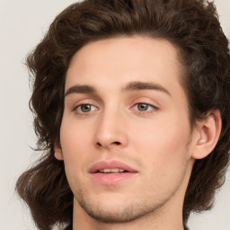 Neutral white young-adult male with long  brown hair and brown eyes
