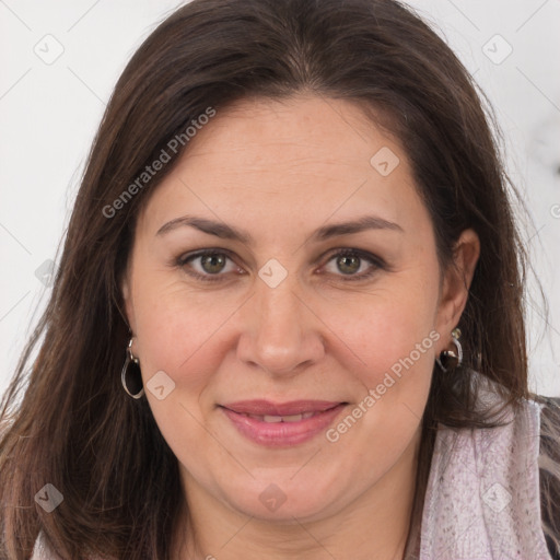 Joyful white adult female with long  brown hair and brown eyes