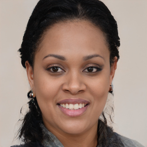 Joyful latino young-adult female with medium  black hair and brown eyes