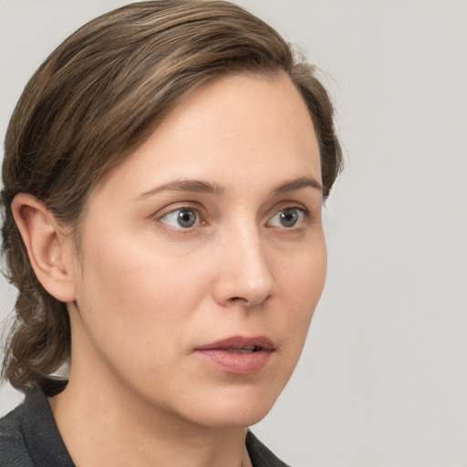 Neutral white young-adult female with medium  brown hair and grey eyes