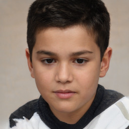 Joyful white child male with short  brown hair and brown eyes