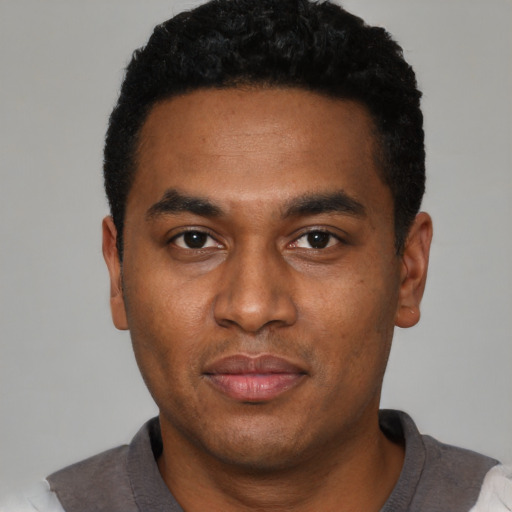 Neutral black young-adult male with short  black hair and brown eyes
