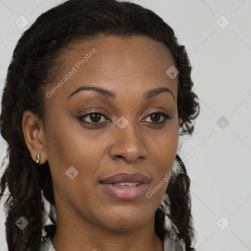 Joyful black young-adult female with long  brown hair and brown eyes