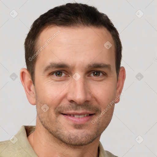 Joyful white adult male with short  brown hair and grey eyes