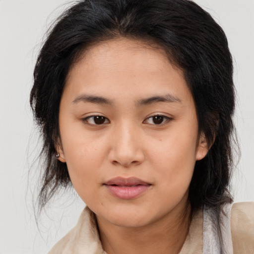 Joyful asian young-adult female with medium  brown hair and brown eyes