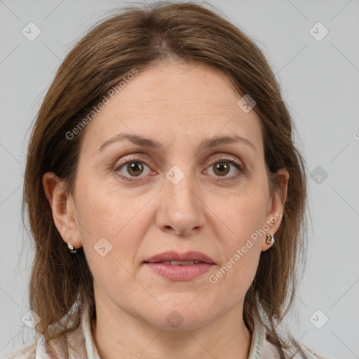 Joyful white adult female with medium  brown hair and grey eyes