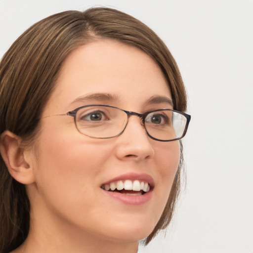 Joyful white young-adult female with medium  brown hair and green eyes