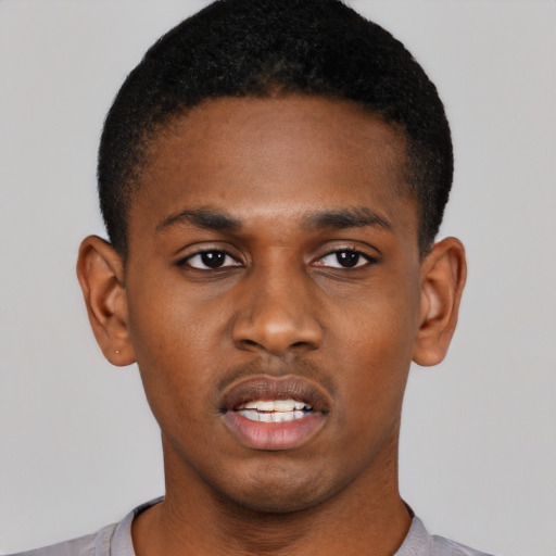 Neutral black young-adult male with short  black hair and brown eyes