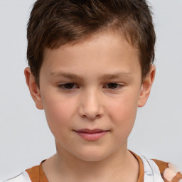 Joyful white child male with short  brown hair and brown eyes