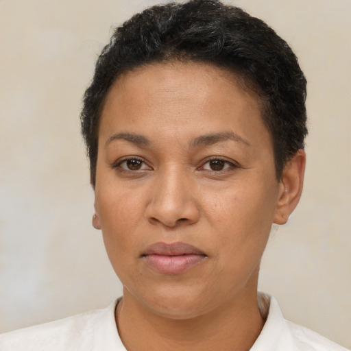 Neutral latino adult female with short  brown hair and brown eyes