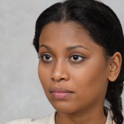 Neutral black young-adult female with medium  brown hair and brown eyes