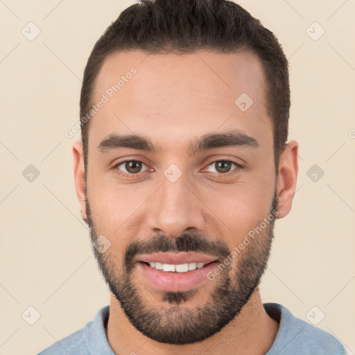 Joyful white young-adult male with short  black hair and brown eyes