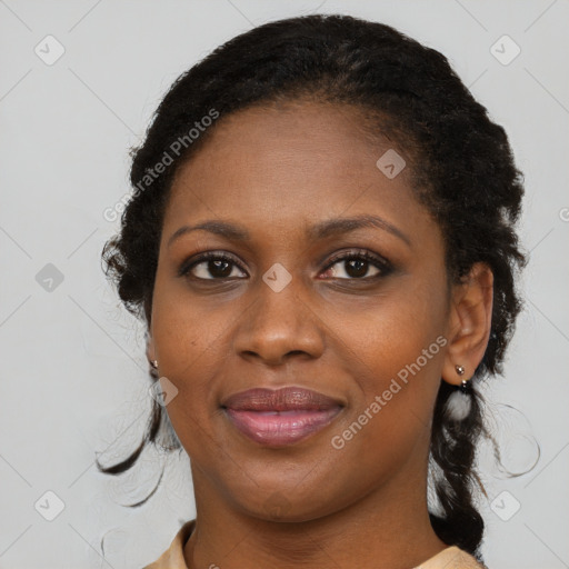 Joyful black young-adult female with medium  brown hair and brown eyes