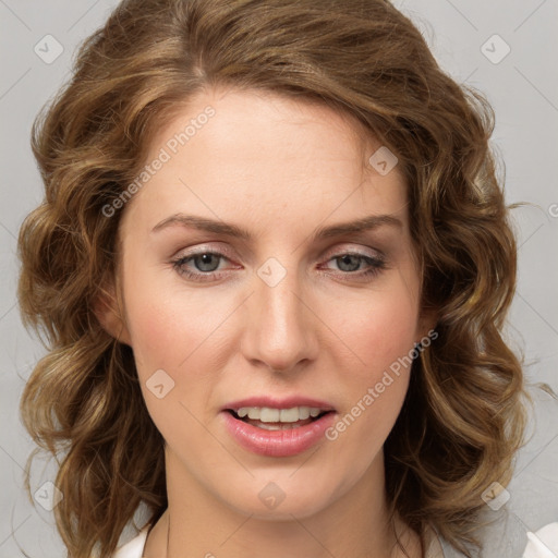 Joyful white young-adult female with medium  brown hair and blue eyes