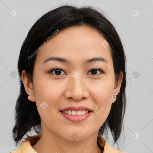 Joyful asian young-adult female with medium  brown hair and brown eyes