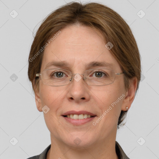 Joyful white adult female with medium  brown hair and grey eyes