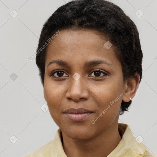 Joyful black young-adult female with short  brown hair and brown eyes