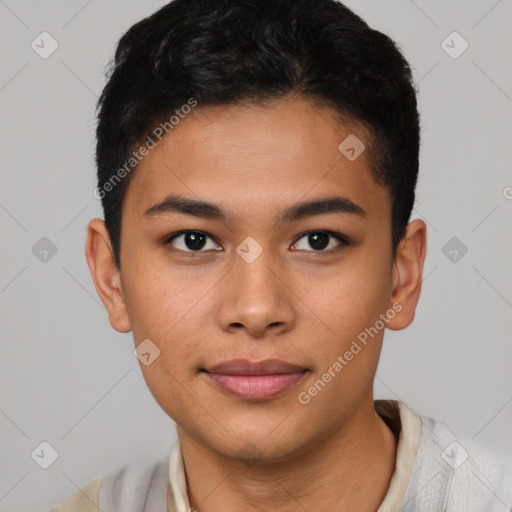 Joyful asian young-adult male with short  brown hair and brown eyes