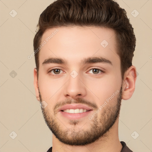 Joyful white young-adult male with short  brown hair and brown eyes