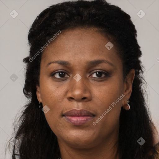Joyful black adult female with short  black hair and brown eyes