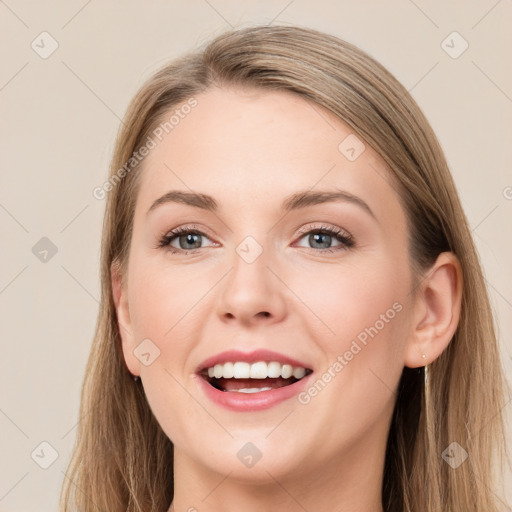 Joyful white young-adult female with long  brown hair and grey eyes